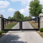 modern inverterd arch entry gate on Sarasota ranch