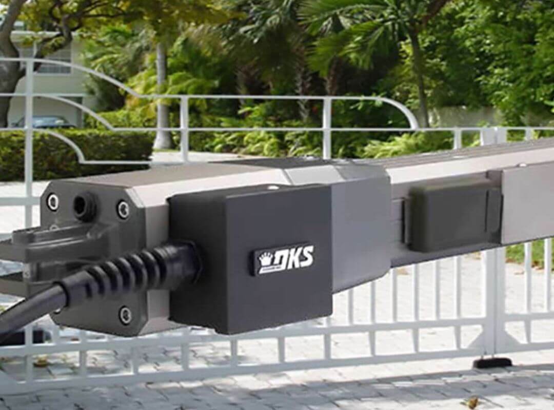 DoorKing DKS barrier arm gate operator mounted on a commercial gate system at an HOA community entry in Florida