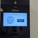 LiftMaster myQ video intercom touchscreen panel with resident search and entry code access installed at an HOA community gate in Sarasota, FL