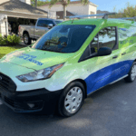 Sarasota Gate & Access branded service van parked in a Fort Myers residential community ready for security gate installation and service