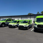 Sarasota Gate & Access full service fleet lined up outside the Bradenton facility — a vendor-credentialed gate company verified on VendorShield, RealPage, Net Vendor, Vive, Vendor Cafe, and Revyse