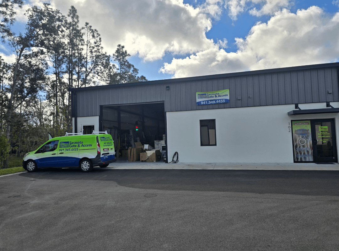 Sarasota Gate & Access — Bradenton Parts Warehouse & Commercial Gate Service Facility Sarasota Gate & Access facility in Bradenton with branded service van, LiftMaster dealer signage, and on-site parts warehouse serving commercial gate installations in Fort Myers and Southwest Florida