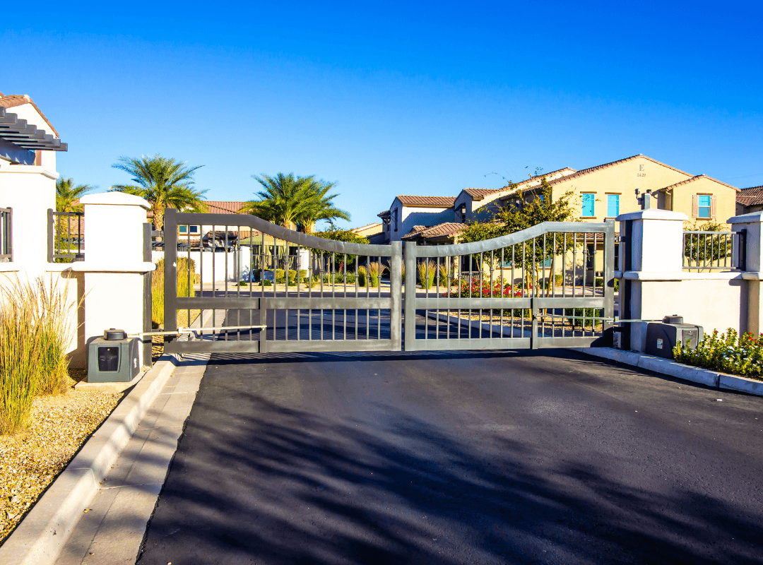 HOA Community Gate Access Control Automated dual swing gate with gate operators at an HOA community entry in Sarasota, FL, the type of access control system Sarasota Gate & Access installs and maintains