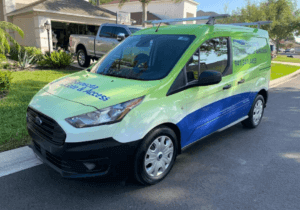 Sarasota Gate & Access branded service van parked in a Fort Myers residential community ready for security gate installation and service