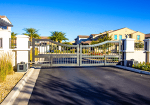 Automated dual swing gate with gate operators at an HOA community entry in Sarasota, FL, the type of access control system Sarasota Gate & Access installs and maintains